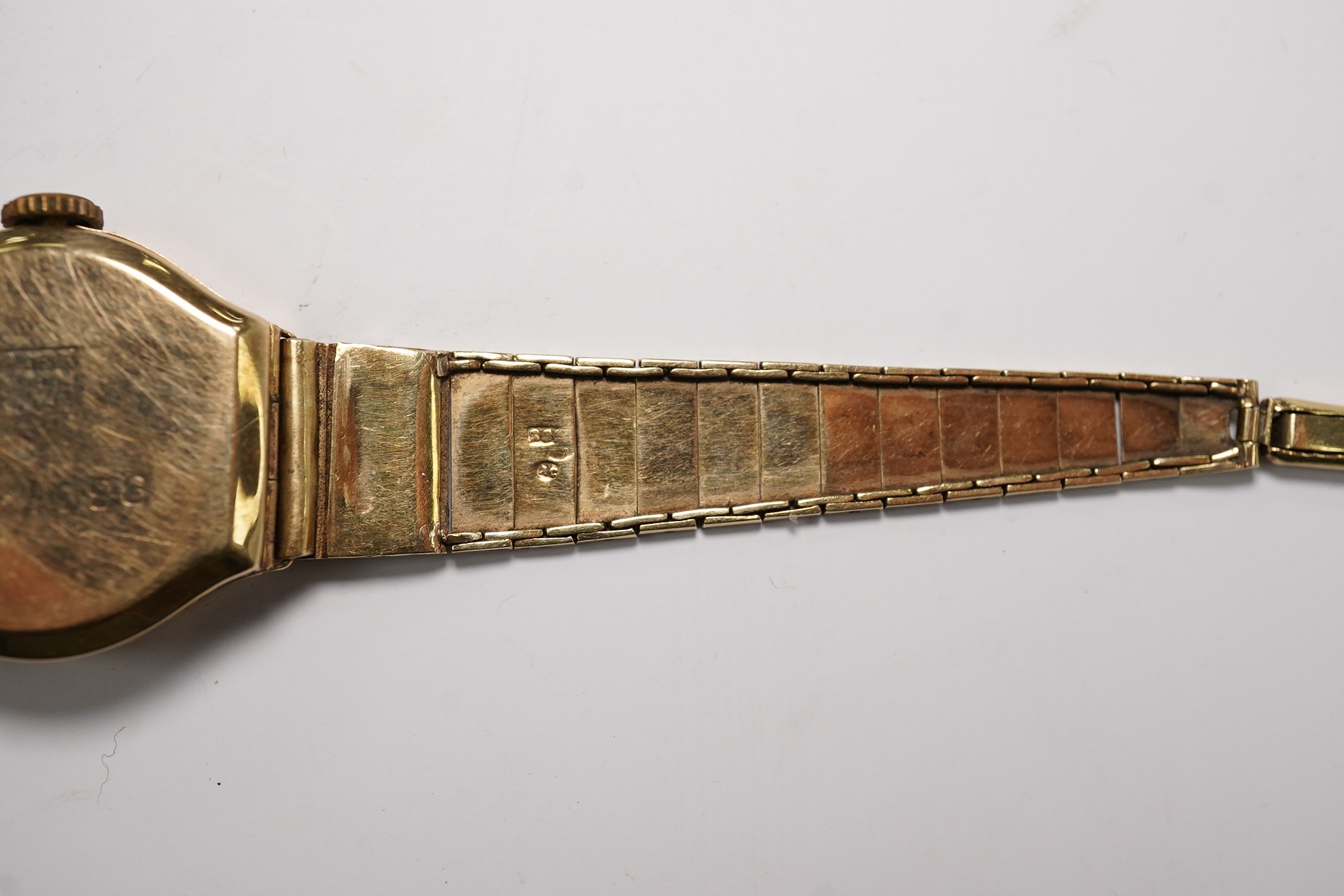 A lady's 14k manual wind wrist watch, on a 14k bracelet, gross weight 14 grams. Condition - poor to fair